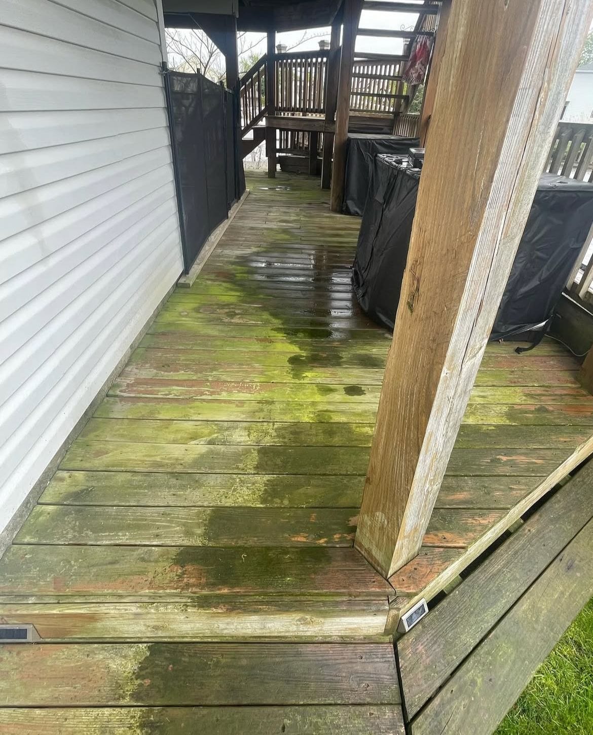 Pressure washing professionals in Long Island Soft washing siding and roofing Experienced handyman on residential job Before and after pressure washing deck Gutter cleaning and roof soft washing Handyman deck repair in progress Exterior house washing project Long Island pressure washing team at work