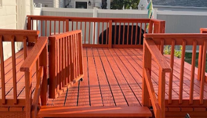 Pressure washing professionals in Long Island Soft washing siding and roofing Experienced handyman on residential job Before and after pressure washing deck Gutter cleaning and roof soft washing Handyman deck repair in progress Exterior house washing project Long Island pressure washing team at work