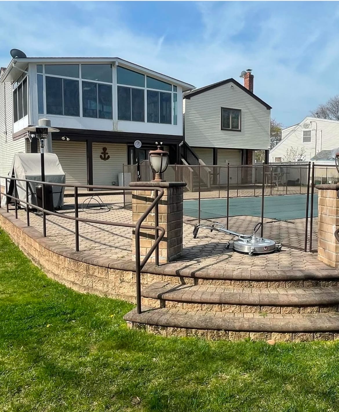 Pressure washing professionals in Long Island Soft washing siding and roofing Experienced handyman on residential job Before and after pressure washing deck Gutter cleaning and roof soft washing Handyman deck repair in progress Exterior house washing project Long Island pressure washing team at work